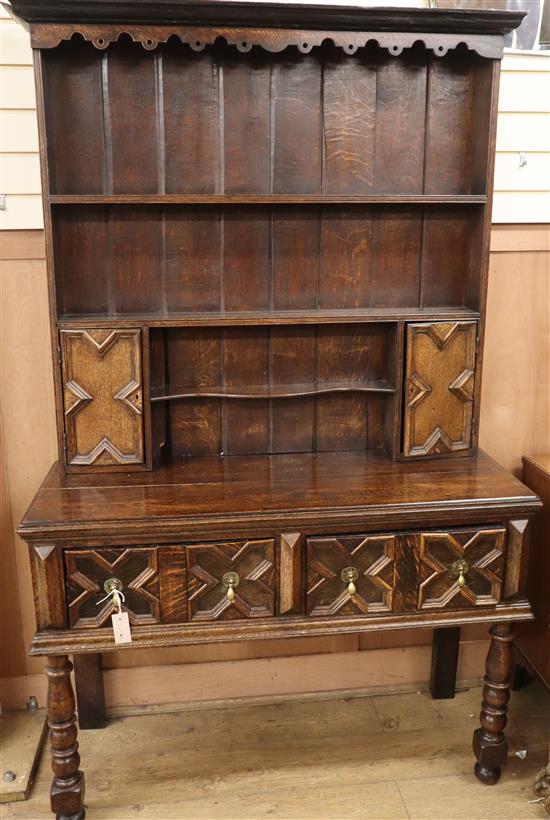 A 17th century style oak dresser W.118cm